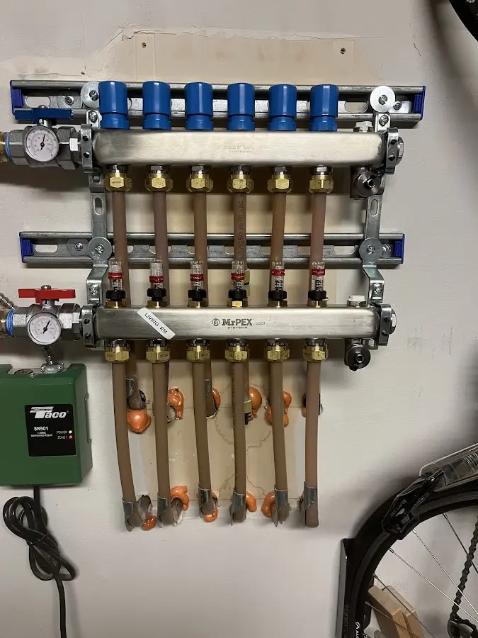 Plumber performing Water Heater Repair at a residential property in Ambler